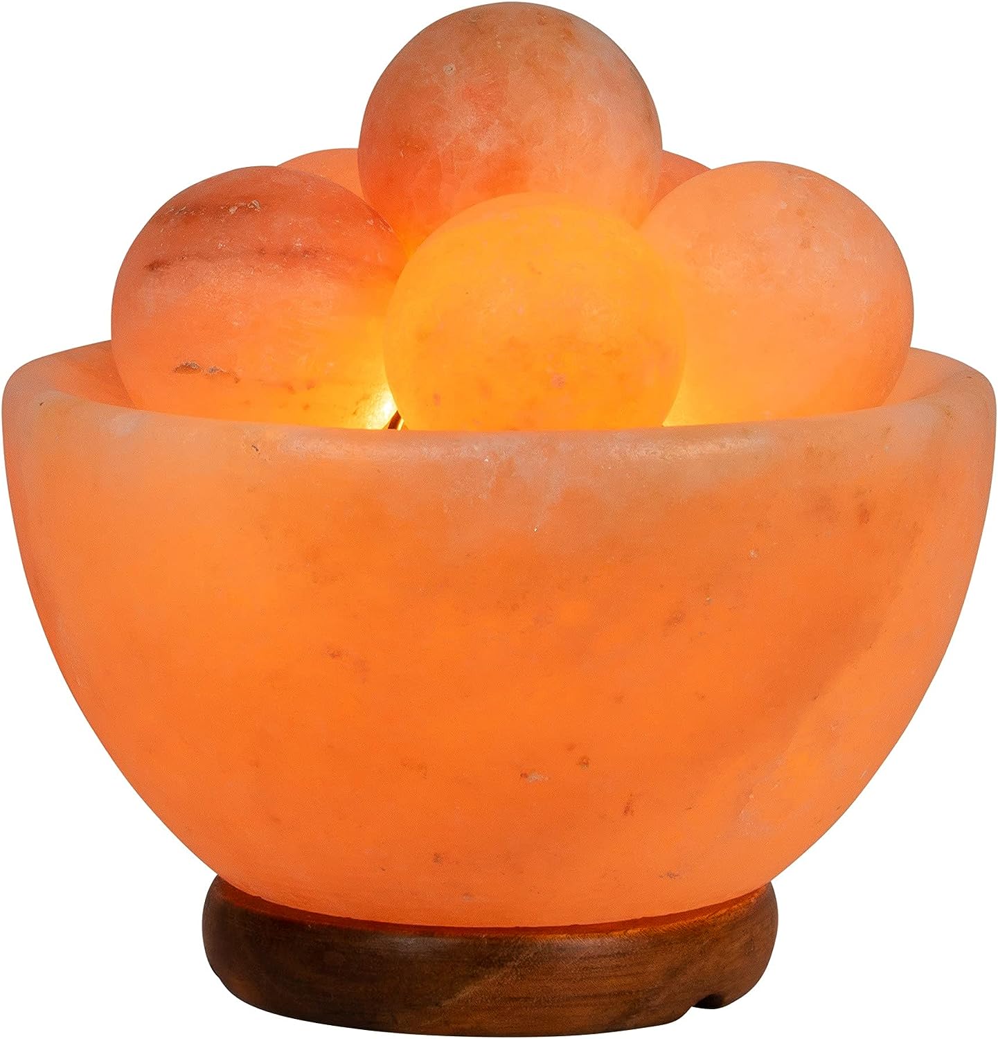 Himalayan salt lamp bowl with glowing spheres.